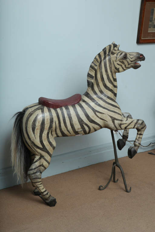 A late 19th century/early 20th century carousel zebra by eminent creater Karl Muller in carved, painted wood.  Ex-coll. Muller/Thummel studio in Molbitz, Germany, thence Fabienne and Francois Marchal collection, Gerardmer, France, inventory no. 54. 