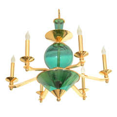 An Italian Turquoise Glass and Brass Six Arm Chandelier.