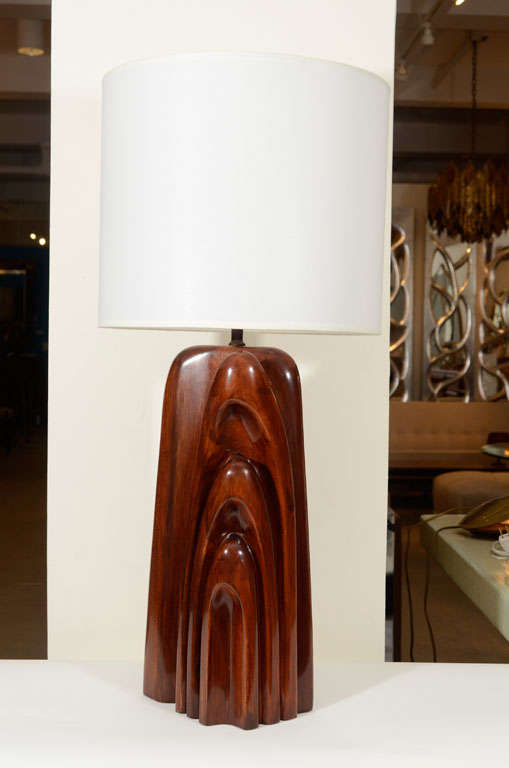 Exceptional modernist carved solid walnut monolithic lamp.