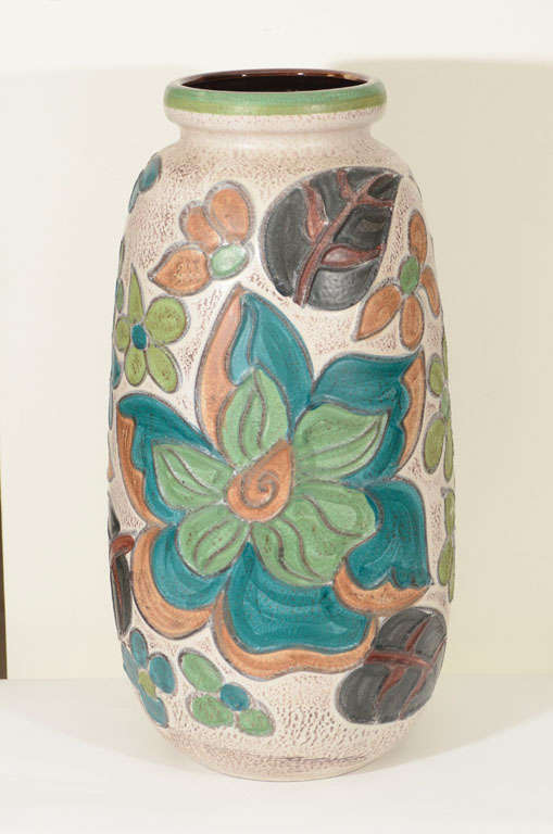 Vibrant colored matte glazed monumental statement vase with incised floral details.