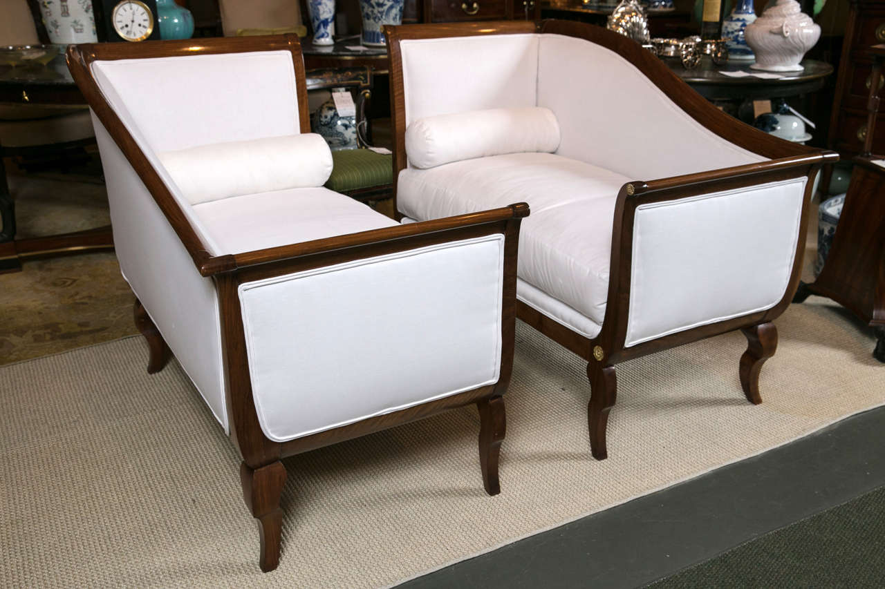 Pair of French natural walnut Empire Meridiennes upholstered in muslin fabric.