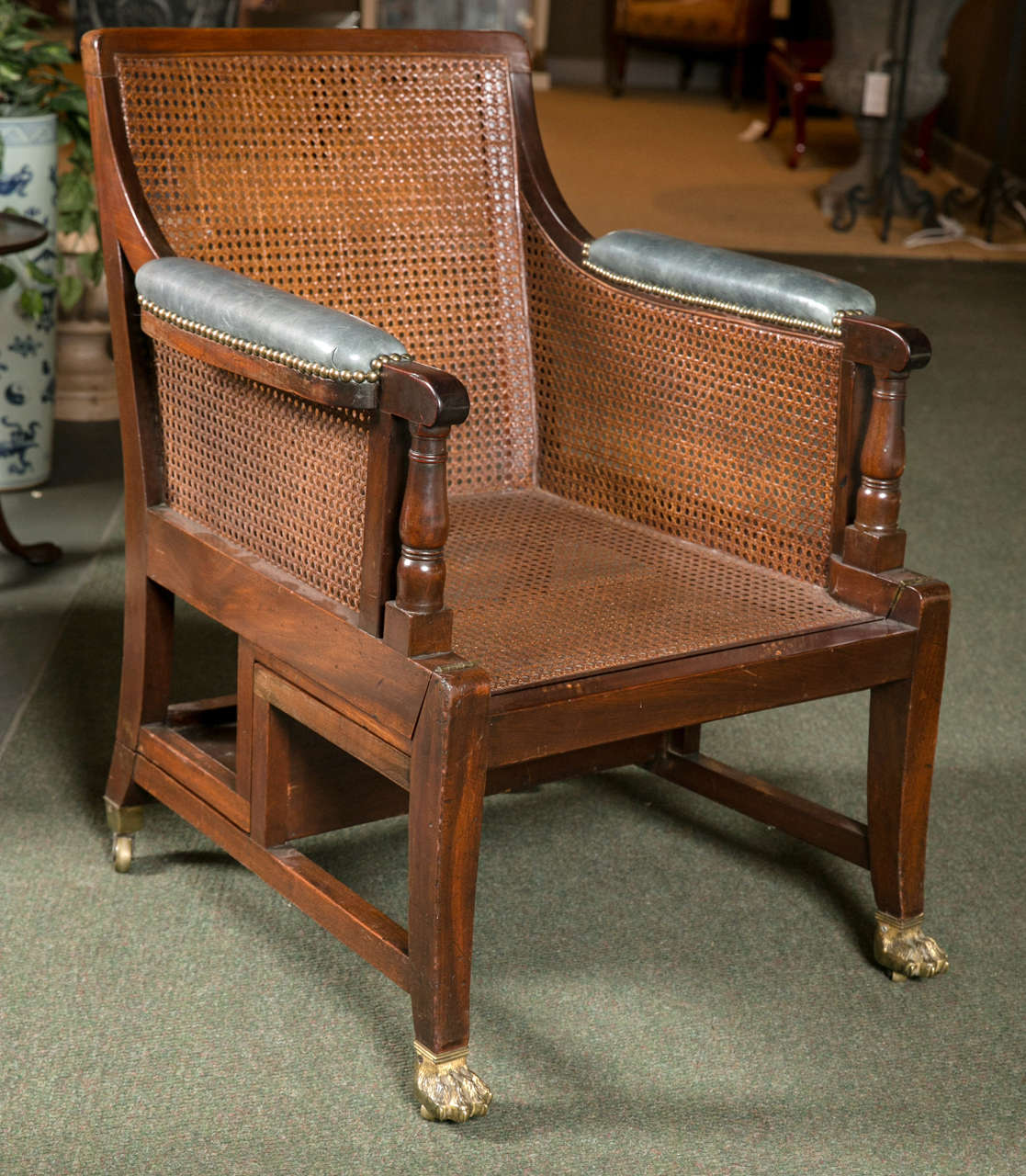 A 19th century Regency cane metamorphic library chair.