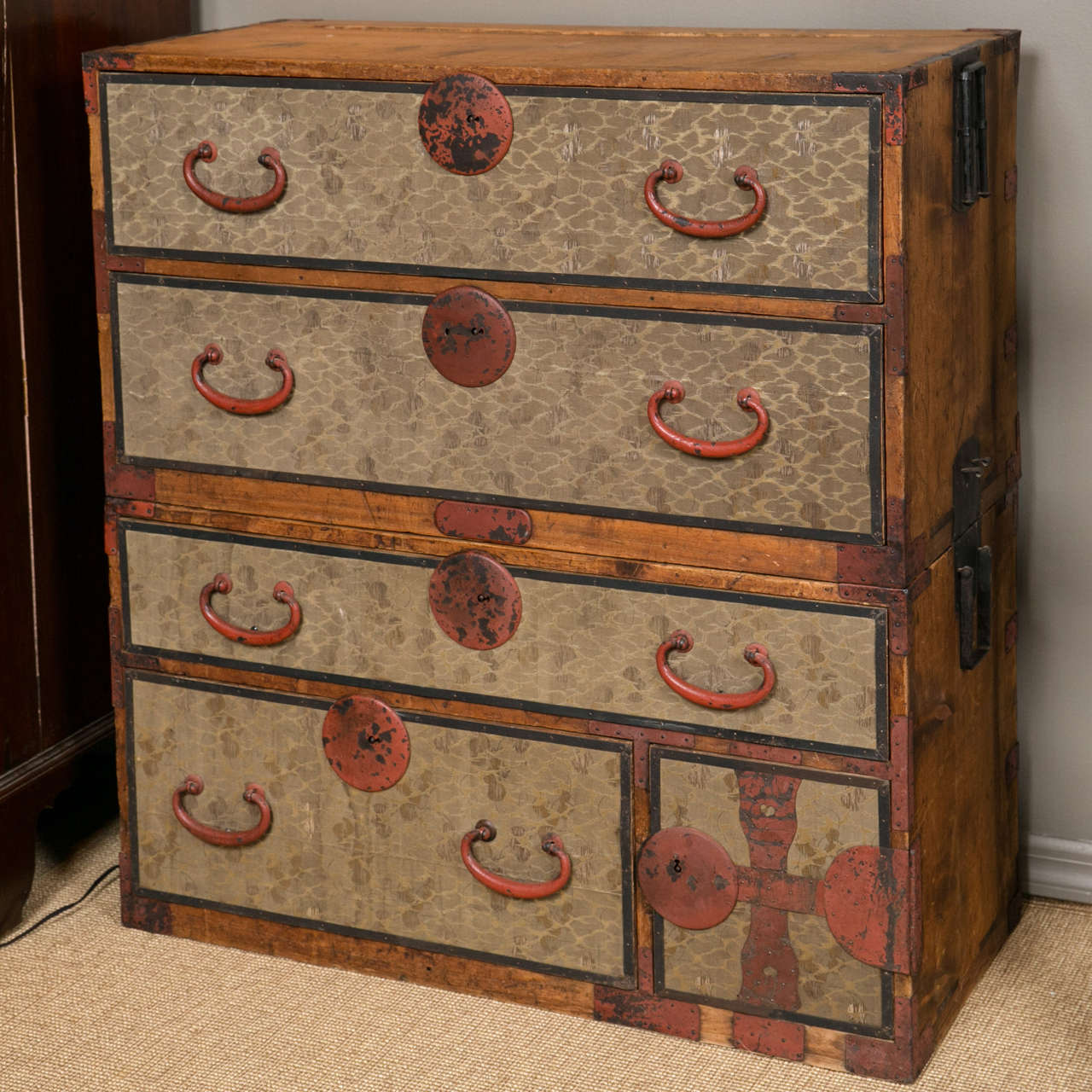 A rare late 18th-early 19th century Japanese Tansu chest of drawers with enameled iron, silk and mixed woods.