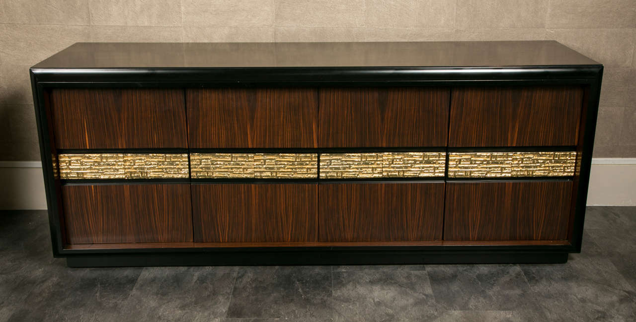 Rosewood sideboard four doors.
Inside shelves and in the middle four drawers.
Gilded bronze insert panel.
Signed on the right side.
The cabinet is furnished with the original catalogue and the original 