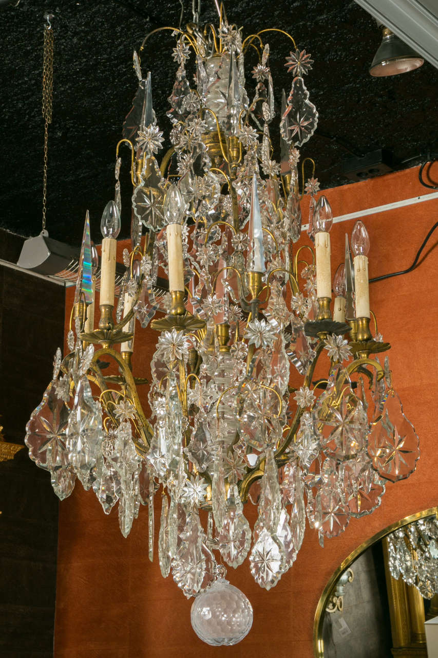 An important pair of Napoleon III° bronze and mouled crystal glass ten lights each chandelier.
It is well riched decorated with original large pendants (6 inches), poignards (7 inches) and stars (2 inches).
The cage is in gilded bronze.
At the