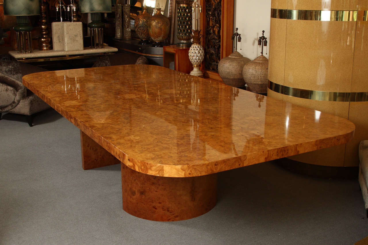 Magnificent and monumental burl wood dining table custom-made for a Deluxe Seattle Penthouse by Steve Chase.
This phenomenal table is supported by two demilune bases which have the identical burrowed finish as the top.
This table comfortably seats
