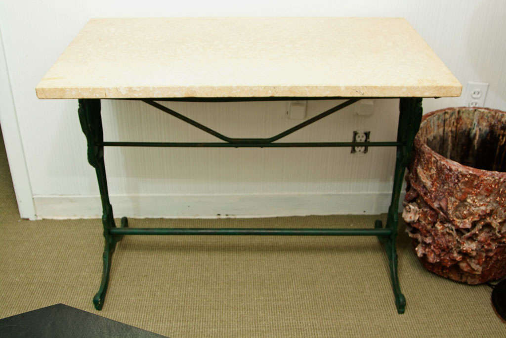 Marble top table with painted cast iron base