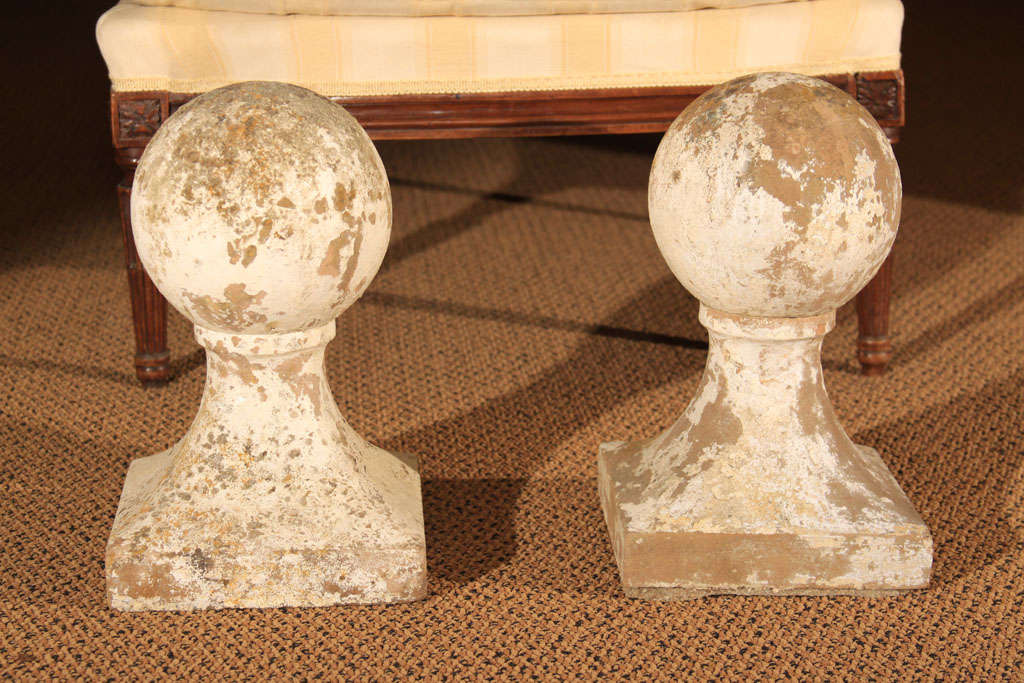 Pair of French Limestone Garden Balls

This is a unique pair of garden balls that have been outside for many years.  The remaining paint adds to their charm.

These were mounted outside and the bases have a bit of the mortar left (which can be