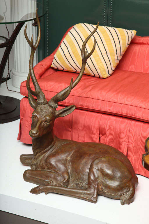 GABRIELLA CRESPI (b. 1922)<br />
Recumbant 4-point stag in bronze with beautiful patina.<br />
Italian, c. 1965