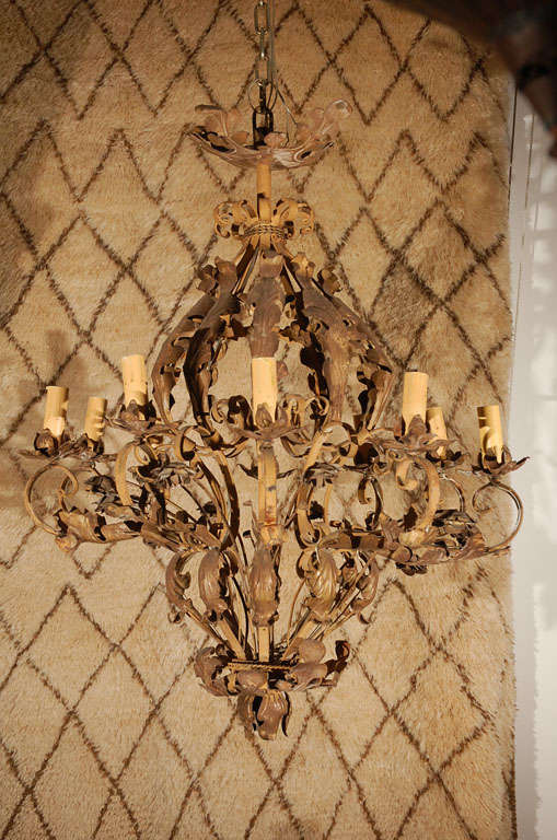 Large impressive French Spanish colonial iron gilt chandelier.
This piece could be use inside or outside in a Moorish Spanish, French or European style patio covered area.
This French chandelier with Italian Florentine influence is highly decorate