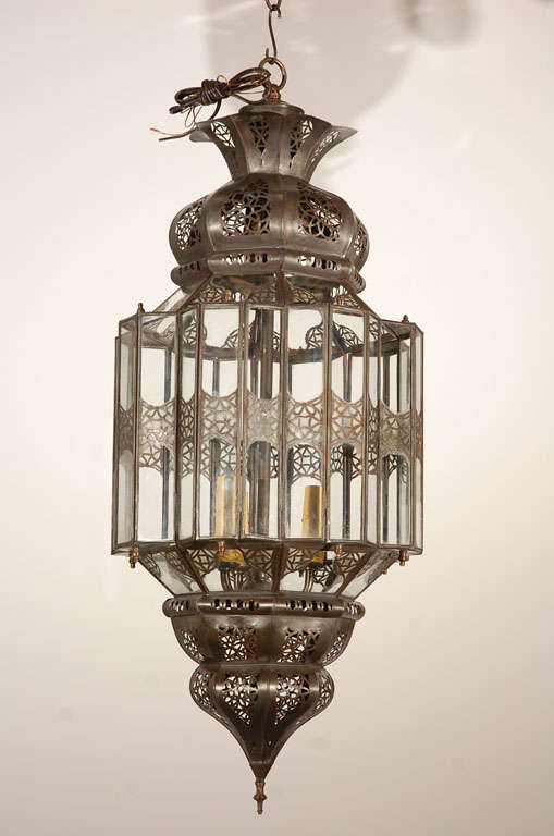 Elegant and stylish clear glass handcrafted Moroccan lantern with intricate filigree work in Moorish style.
Will add elegance in any room.
Rewired with three lights, ready to use, comes with 3 feet chains and ceiling canopy.
