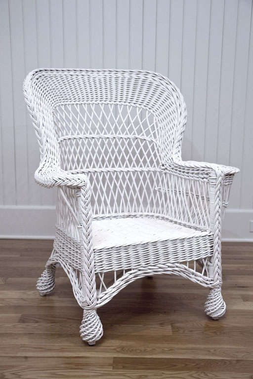 Willow and reed Bar Harbor wicker side chair. Beautiful woven back with magazine pocket resting on large pineapple feet.

Dimensions:  34