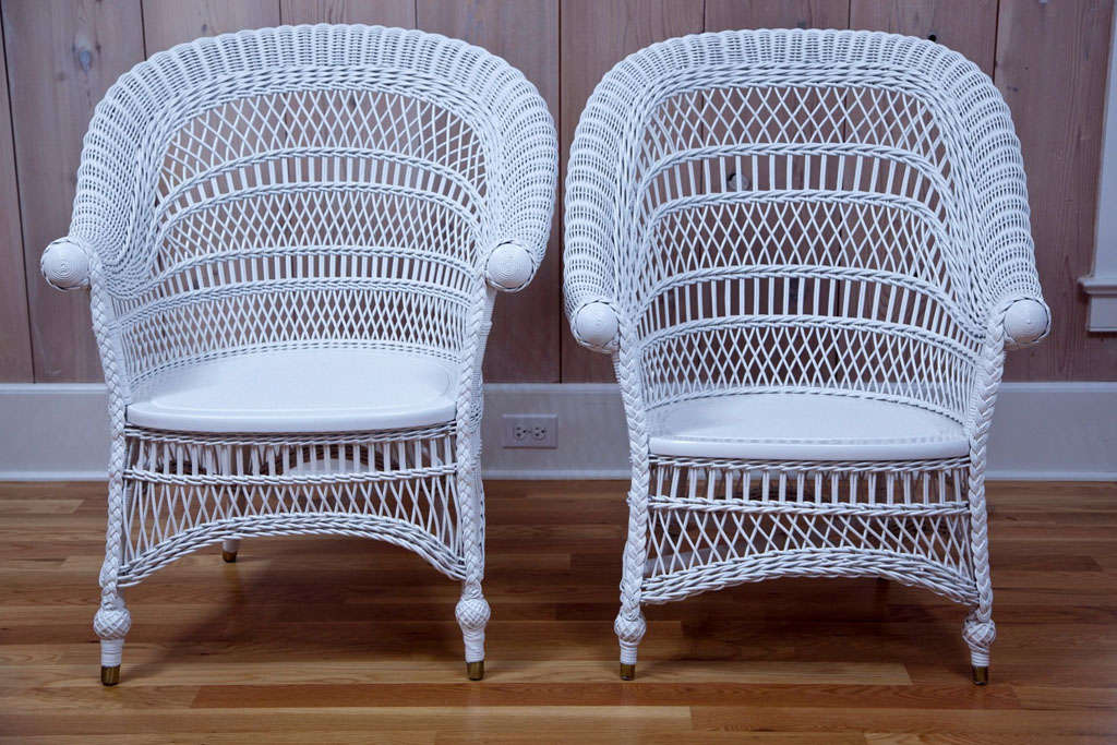 Stylish, turn of the century, wicker rolled-arm side chairs with elegant lattice design on back and skirt.

Dimensions:  29