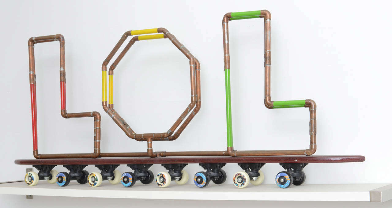 One of a kind skateboard LOL sculpture by artist Tom Banks. This is from his earlier works and is actually one of his first pieces, using pieces of copper pipe to spell out the currently most texted word in the English Langauge, LOL. This cool POP