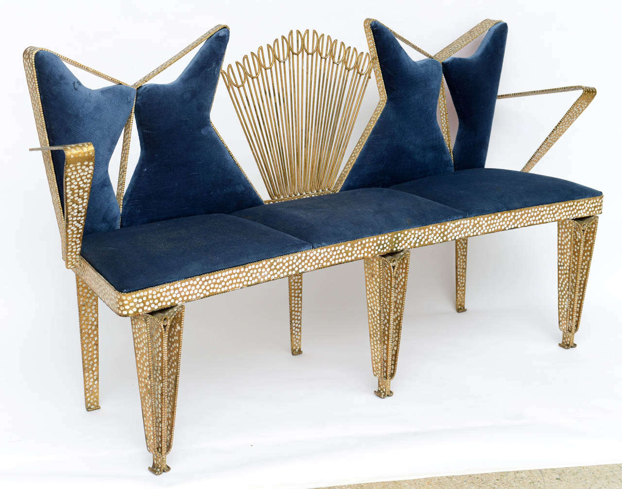 All done in fine hand-hammered gilt iron with upholstered areas.