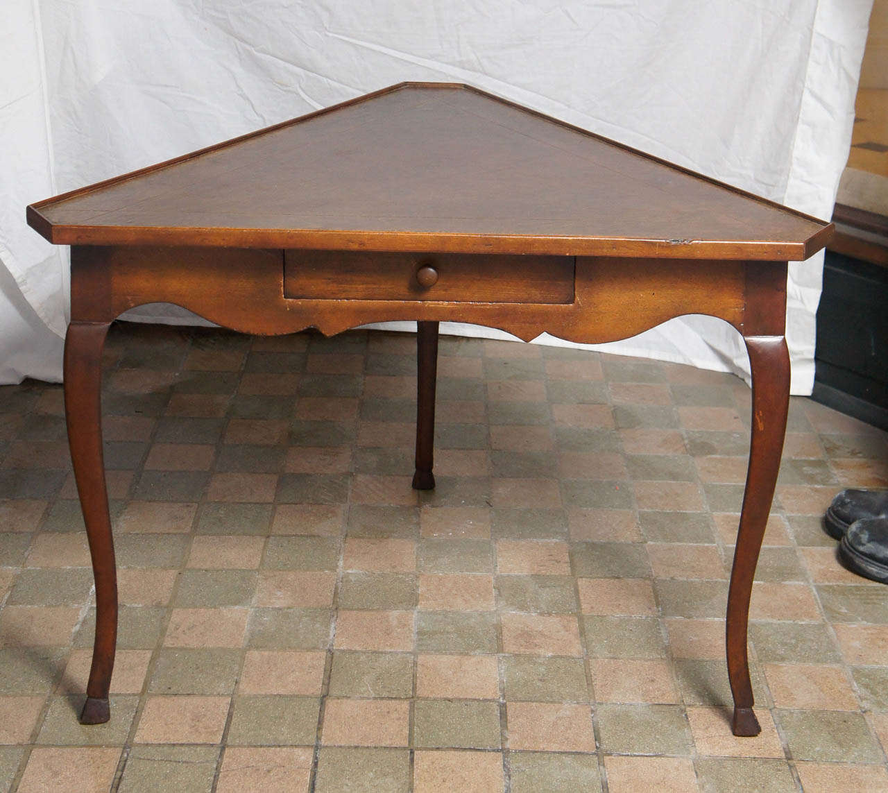 Made in the 60's this lovely pair of tables  sold through Yale Burgess are mostly likely made in France for export to this country. The walnut has a nice old color showing the attention to detail the firm is best know for. Designed in a Louis XV
