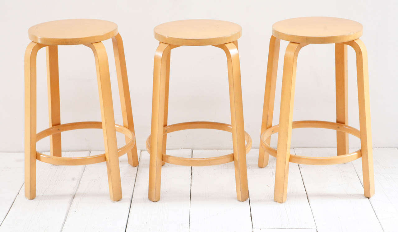 Set of three Alvar Aalto birch wood laminate counter / bar stools.