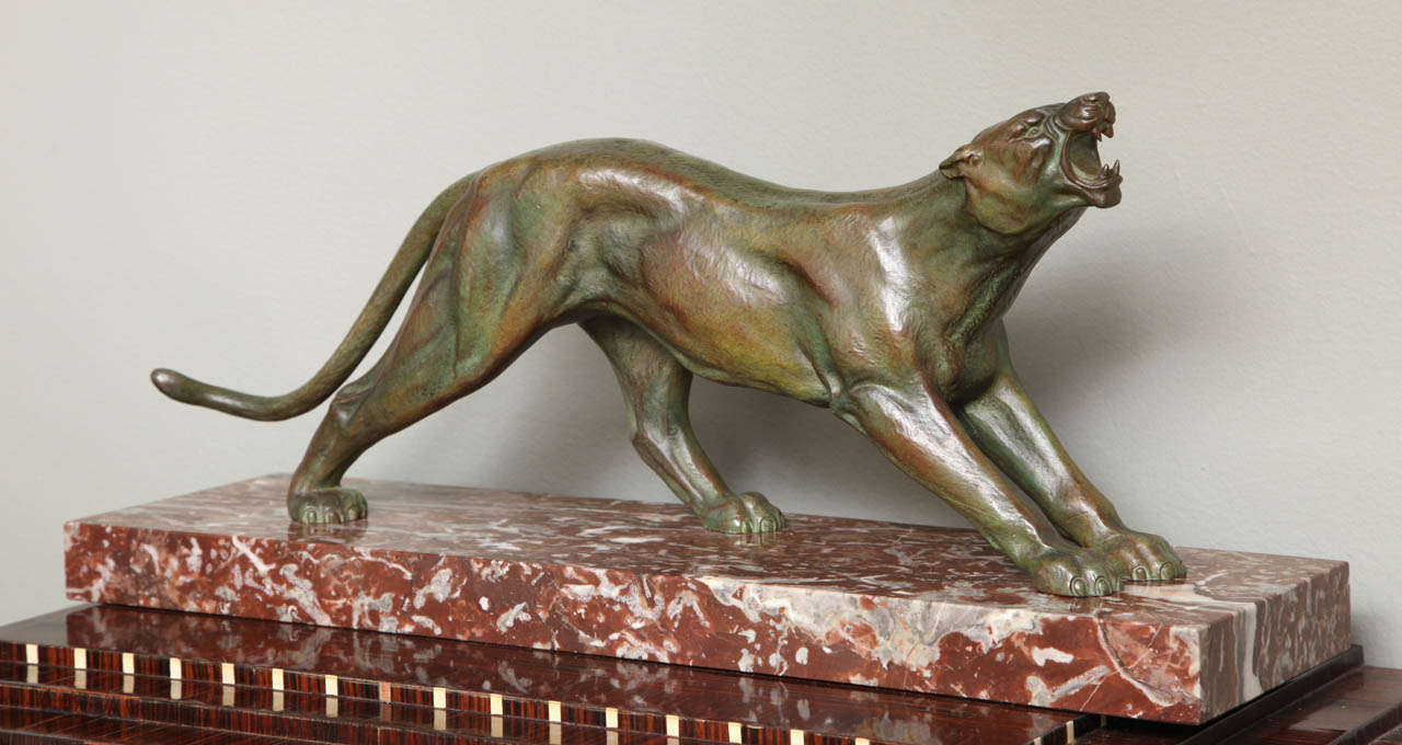 A French Art Deco Panther by J. Davergne, green patinated bronze on marble base, circa 1930s, incised signature on the marble.
Measures: 23.6