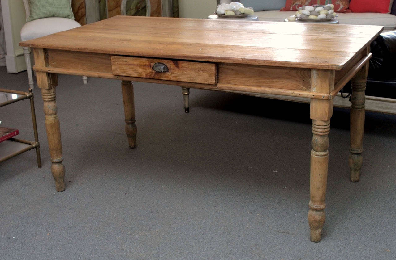 Rustic Italian pine farm table with single drawer, cup handle and turned legs.  Also suitable for use as a desk. C 1900
