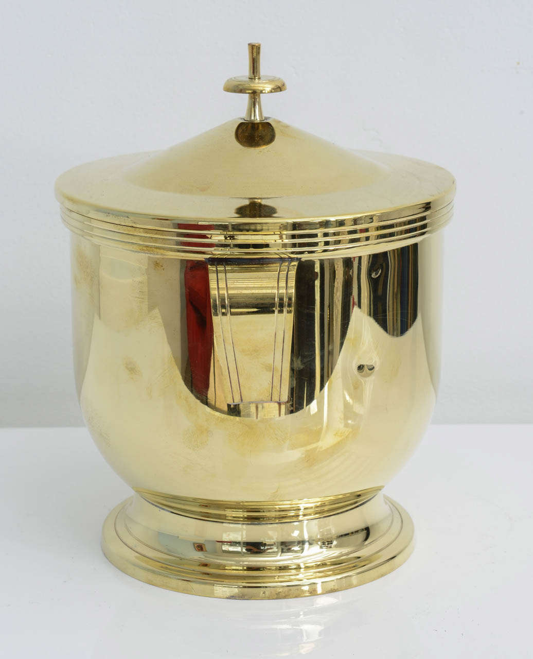 Mid-Century Modern Tommi Parzinger polished brass covered ice bucket For Sale