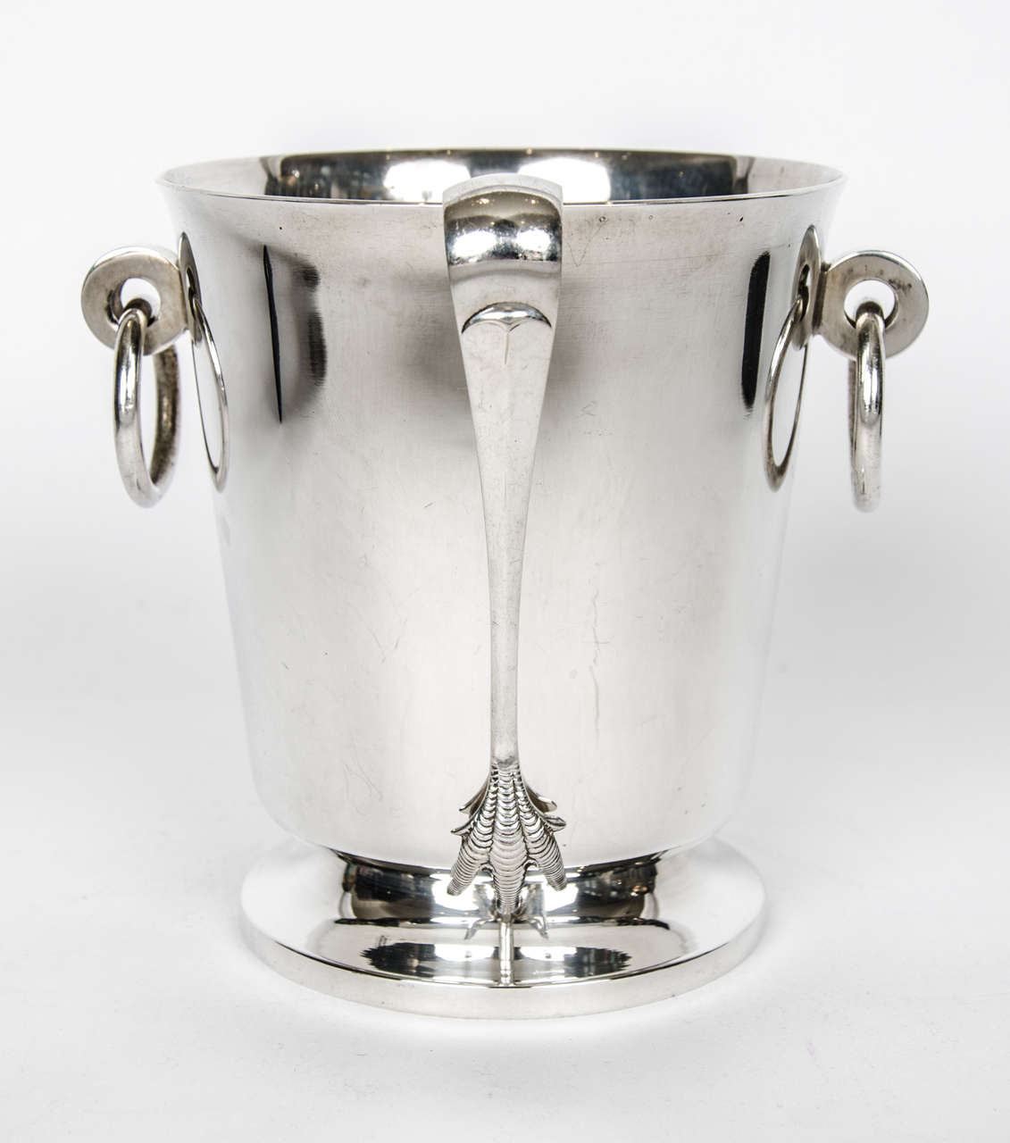 Silver plate ice bucket and tongs, circa 1920. Detailed tongs with chicken feet. Ice bucket has two ring handles in plain polished silver.

Please enquire for shipping rates due to size and nature of item.