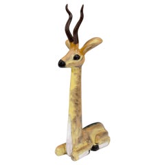 A Midcentury Ceramic Sculpture of a Seated Antelope
