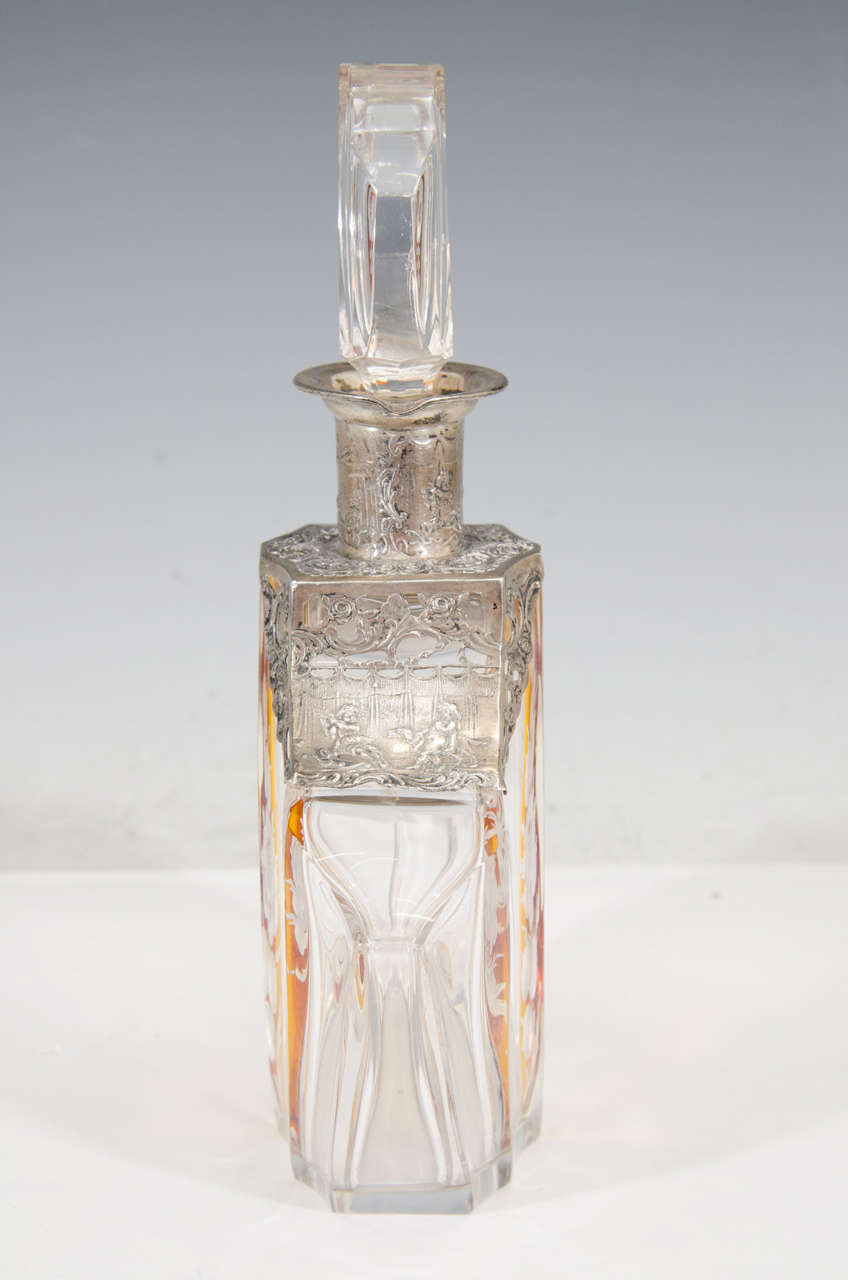 A Vintage Crystal and Amber Color Decanter with Silver Overlay 1