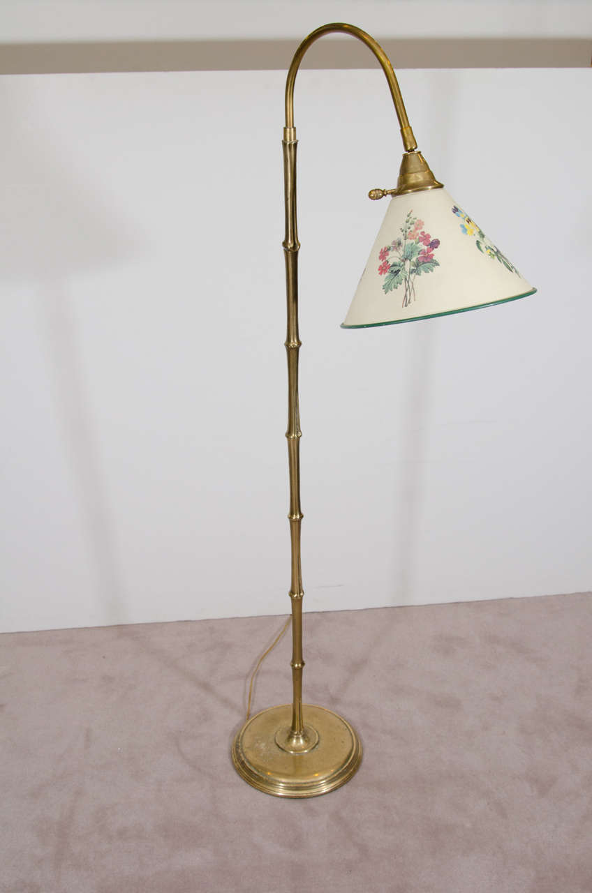 A vintage brass 'bamboo' reading floor lamp with a 'floral' shade, in the style of Maison Baguès. Good vintage condition with age appropriate wear and patina. Item available here online. By request, item can be made available by appointment to the