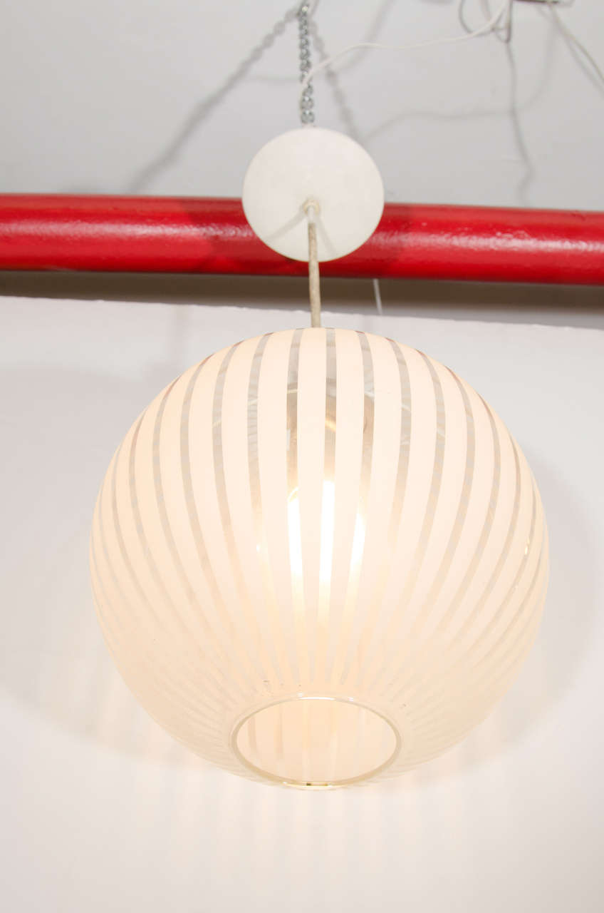 An Italian Midcentury Clear Glass Globe Pendant with White Stripes For Sale 1