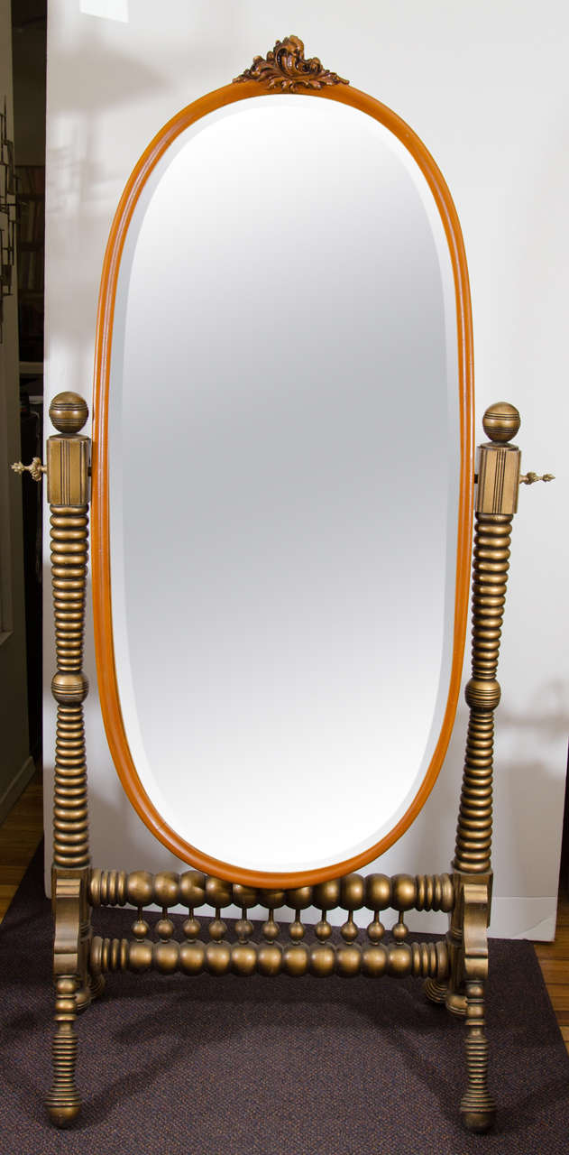 A 19th century pivoting French Cheval beveled mirror with gold trim.  All original.  Good condition with age appropriate wear.  Some silvering to the mirror and craquelure to the wood.