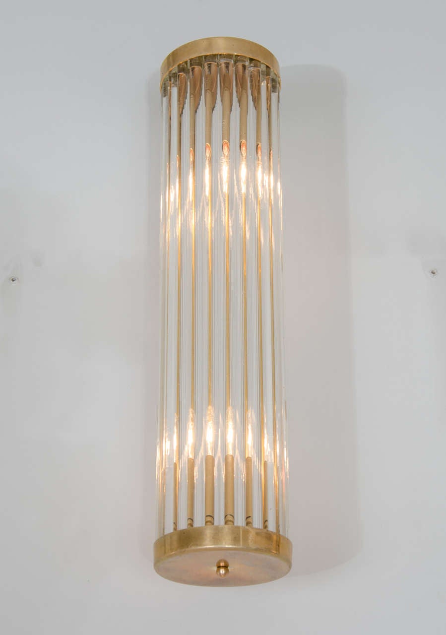 Italian, 1950s, cylindrical brass wall lights on arms, signed 'Venini.'