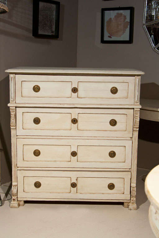 Charming distress-painted Swedish Gustavian Style chest of drawers, 19th century. The beveled top over a conforming case fitted with four drawers, flanked by columnar uprights, raised on blocked feet.