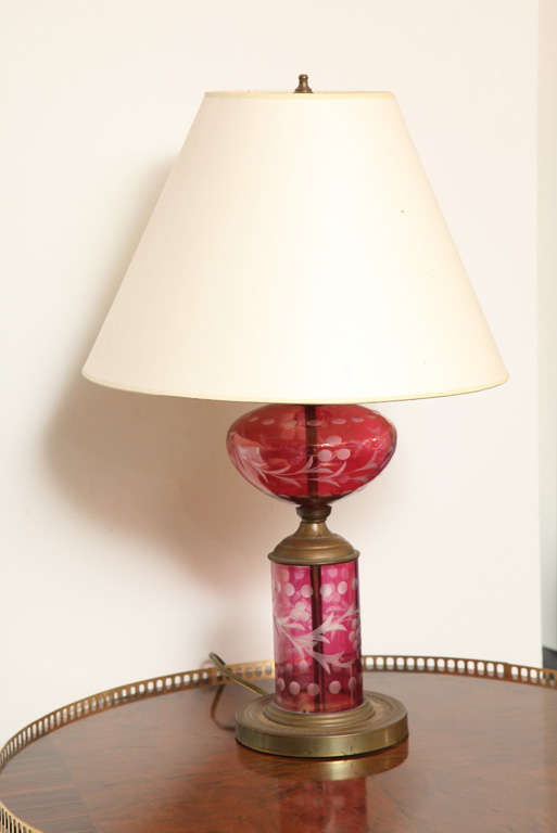 The glamorous pettit lamp has many details in its glass body. The bronze has edged beautifully developing a patina. Its shape is organic and classical and offers a warm light. It has been updated with a new custom-made silk lamp shade with 14