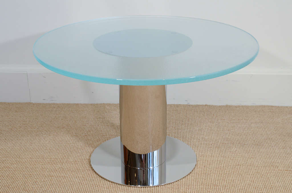 The cylindrical chrome base supporting a textured glass top. Made to order.