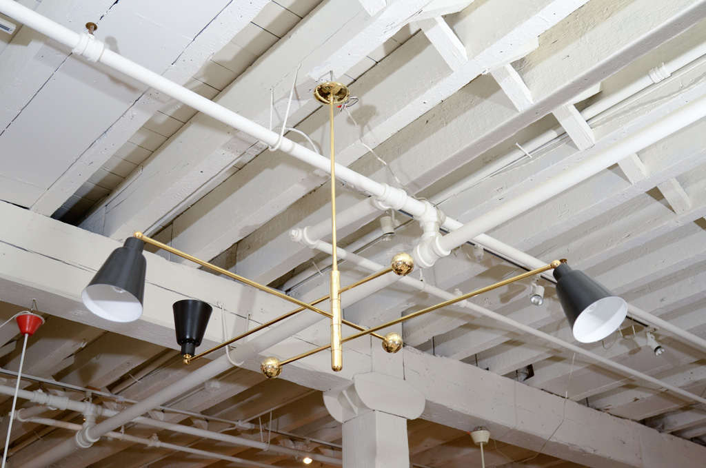 An Italian Brass and Black Enamel Three Light Adjustable Ceiling Fixture.