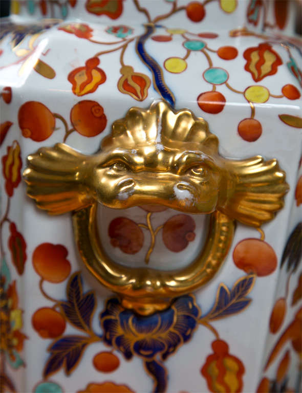 Japanese Imari porcelain jar, the top of the lid has a foo dog motif, on each side of the jar there is also a foo dog motif. Small missing piece on top.