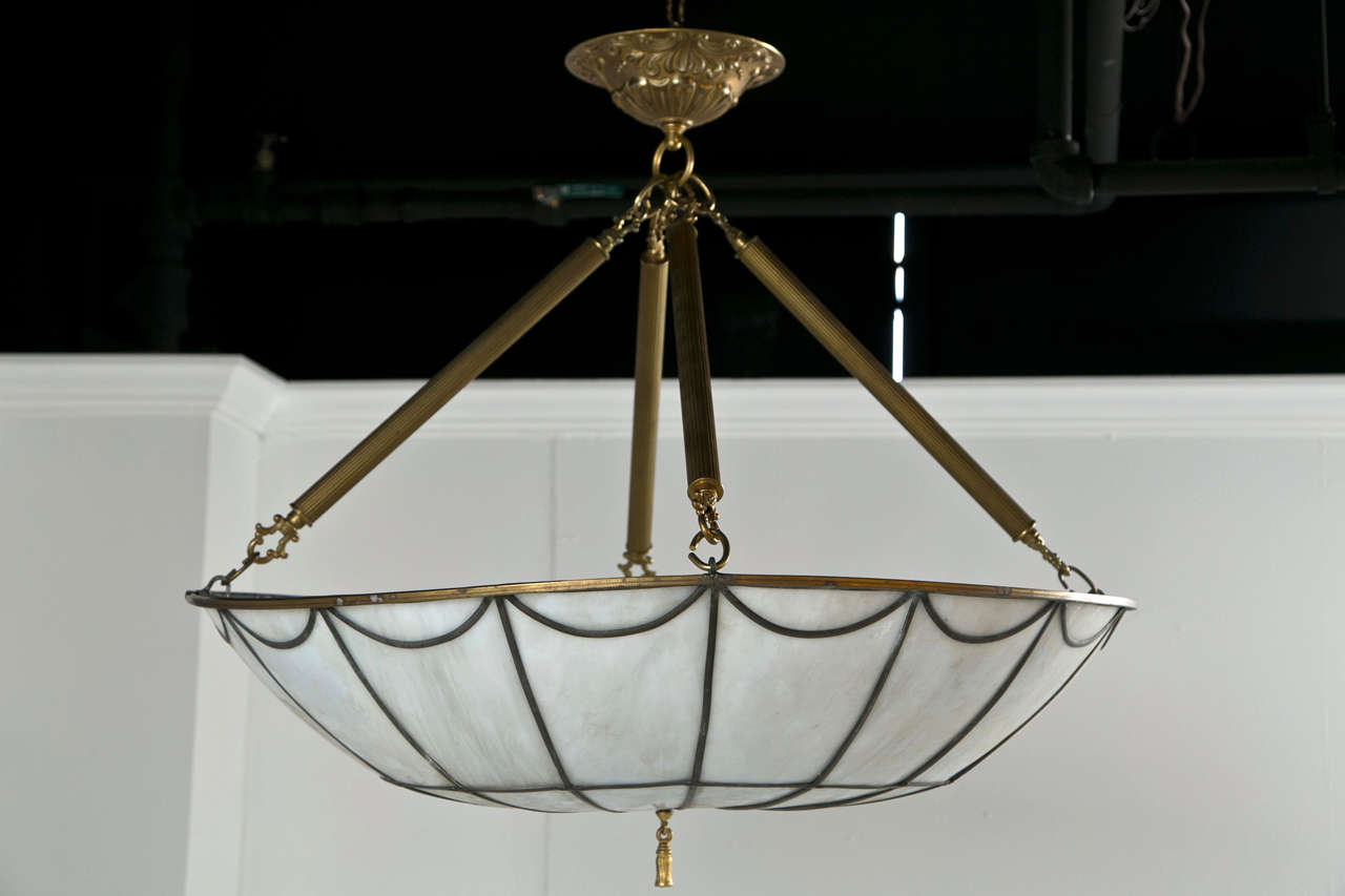 A stunning Leaded glass fixture circa 1920's with gilt bronze accents.
Six available. priceed individually.