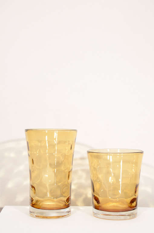 Set of 12, 6 water glasses and 6 soft drink glasses molded into a graceful shape with a slight flaring at the rim. The indented pattern adds a nice detail making this a unique set.