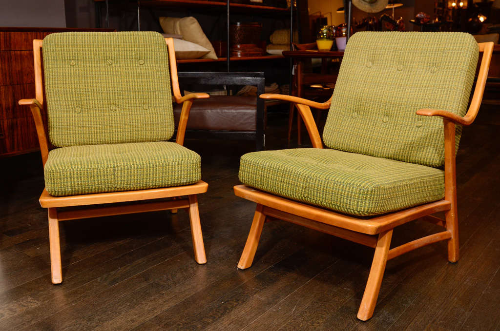 Vintage mid century armchairs designed with slope and height for lounging. Classic modern lines and a smooth polished frame finish with original upholstery. 