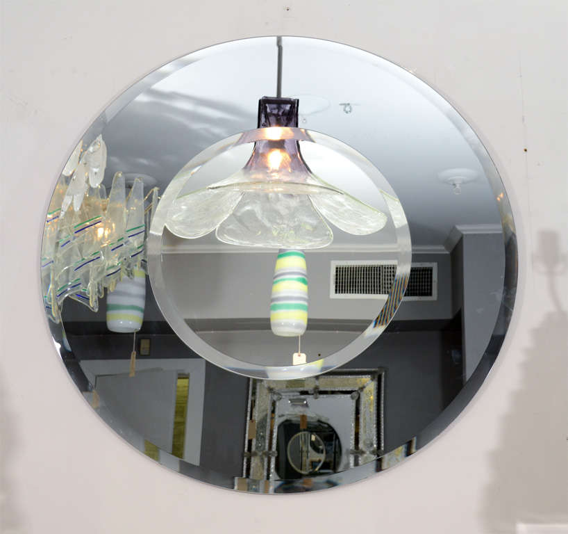 Custom round beveled mirror with bold smoke glass border. Customization is available in different sizes and glass colors.