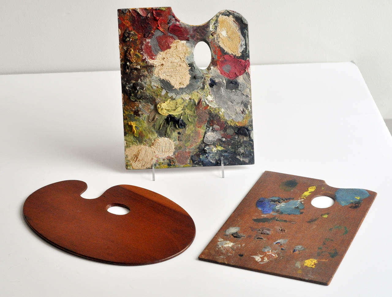 An interesting trio of vintage palettes of different sizes and degrees of
impasto. One palette is marked 