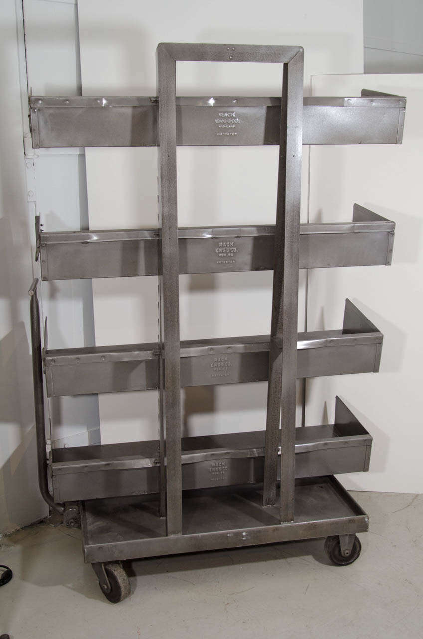 Metal cart with four adjustable shelves. Very Industrial chic.