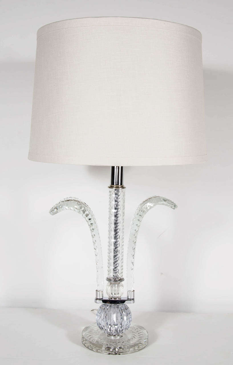 This  crystal lamp features fine cut crystal plumes, stem and bases with a cross hatched cut crystal design.The lamp has  chromed fittings has  been completely rewired and also has been fitted with a custom shade.