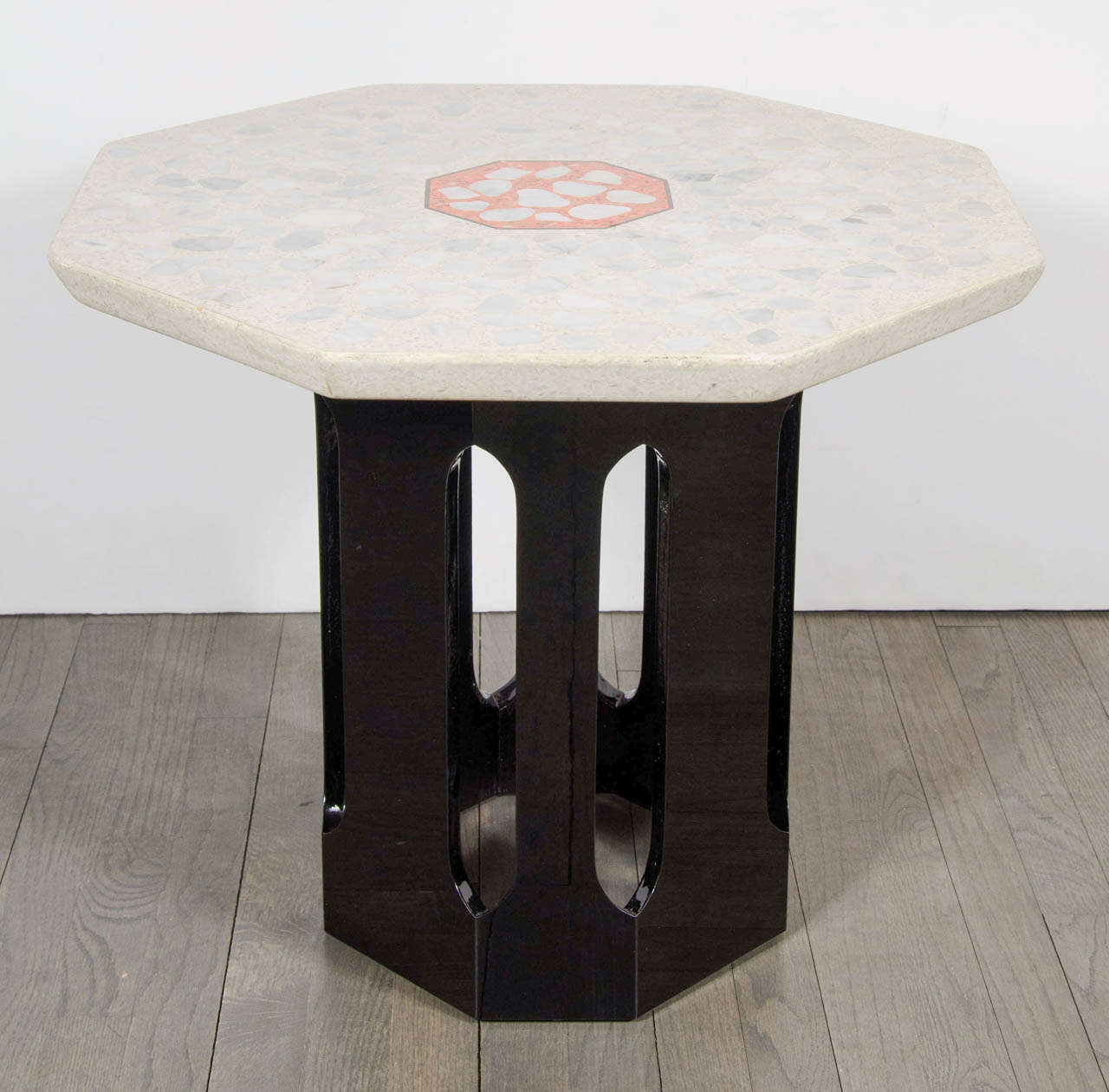 This rare and stunning occasional table by Harvey Probber- the legendary Mid Century Modern designer who produced elegant hand crafted furniture in Fall River, Massachusetts.  It features an octagonal terrazzo top with a decorative inlaid design in