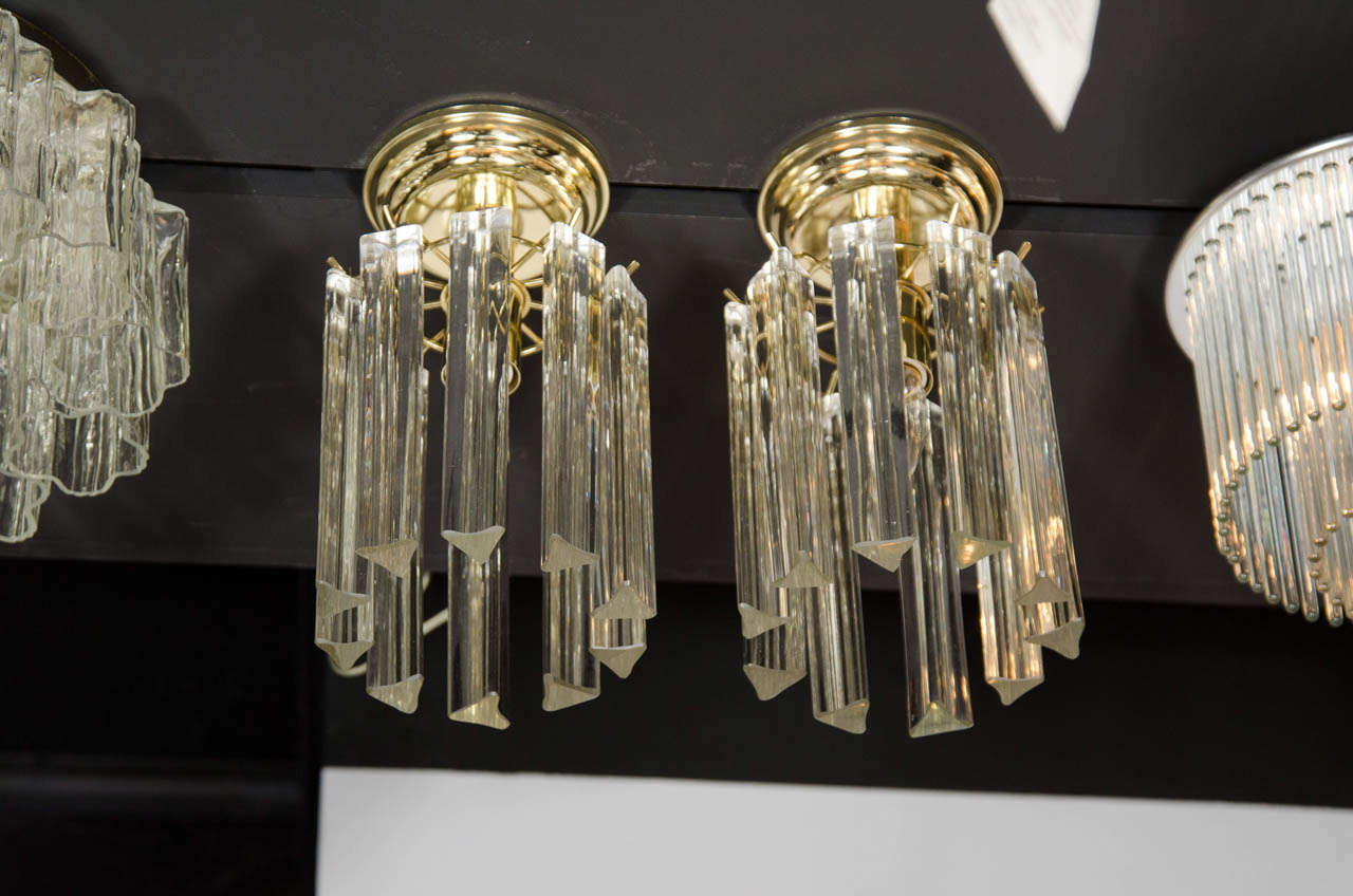 Elegant pair of Mid-Century Modernist Crystal flush mount chandeliers by Camer.  Each flush mount chandelier features ten hand blown Murano Triede Crystals suspended from a brass canopy with brass fittings.  Each flush mount chandelier has been