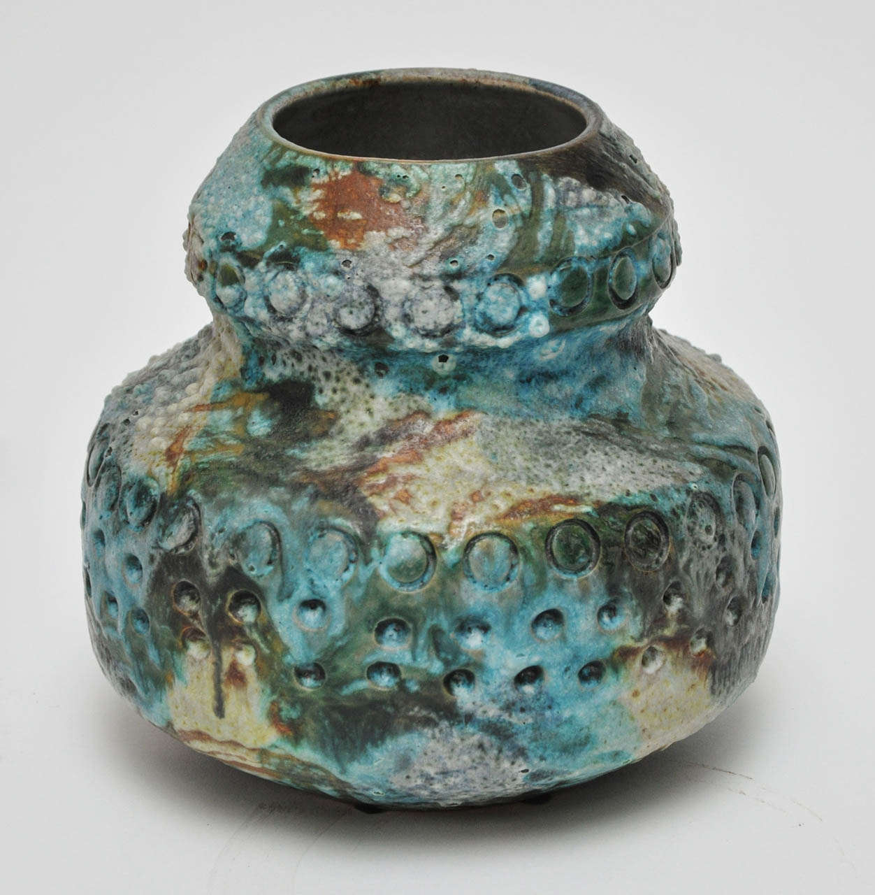Low profile ceramic glazed vase.
