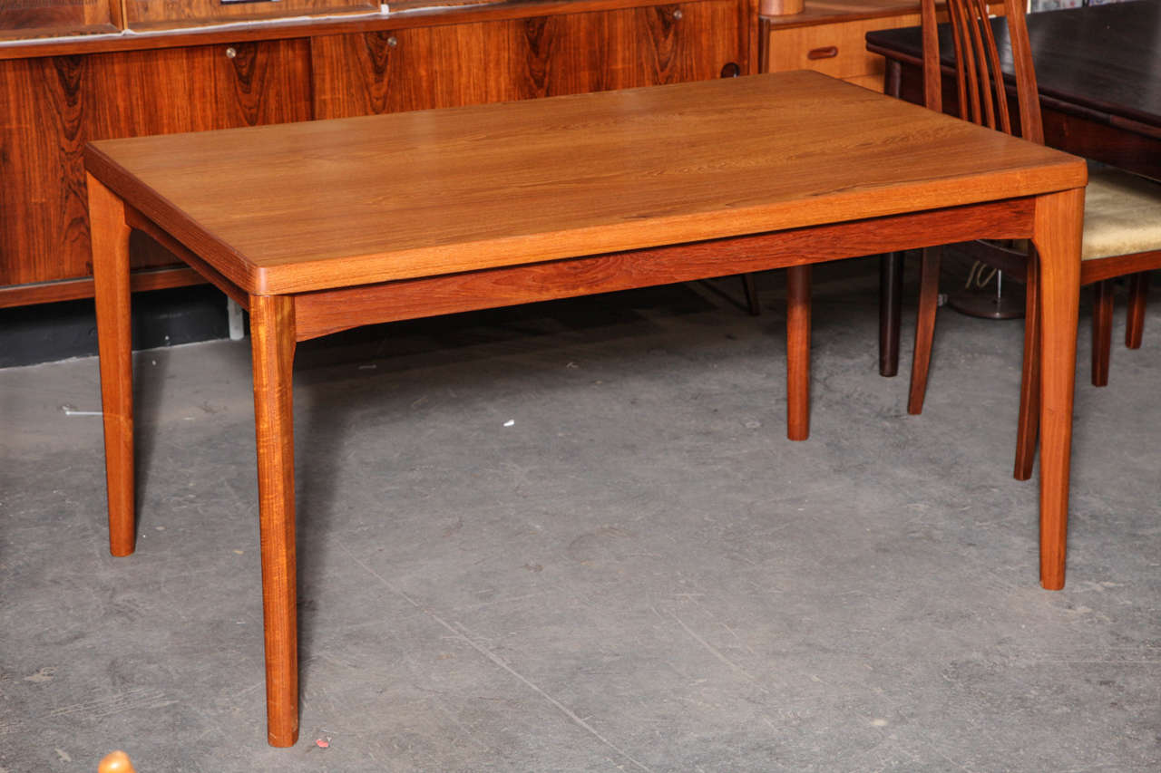 Vintage 1960s Henning Kjaernulf Danish Dining Table with Pull Out Leaves

This Danish Teak Dining table features hidden draw leaves, cleverly tucked beneath the table top. Beautiful in a small dining room or great as a busy kitchen table.