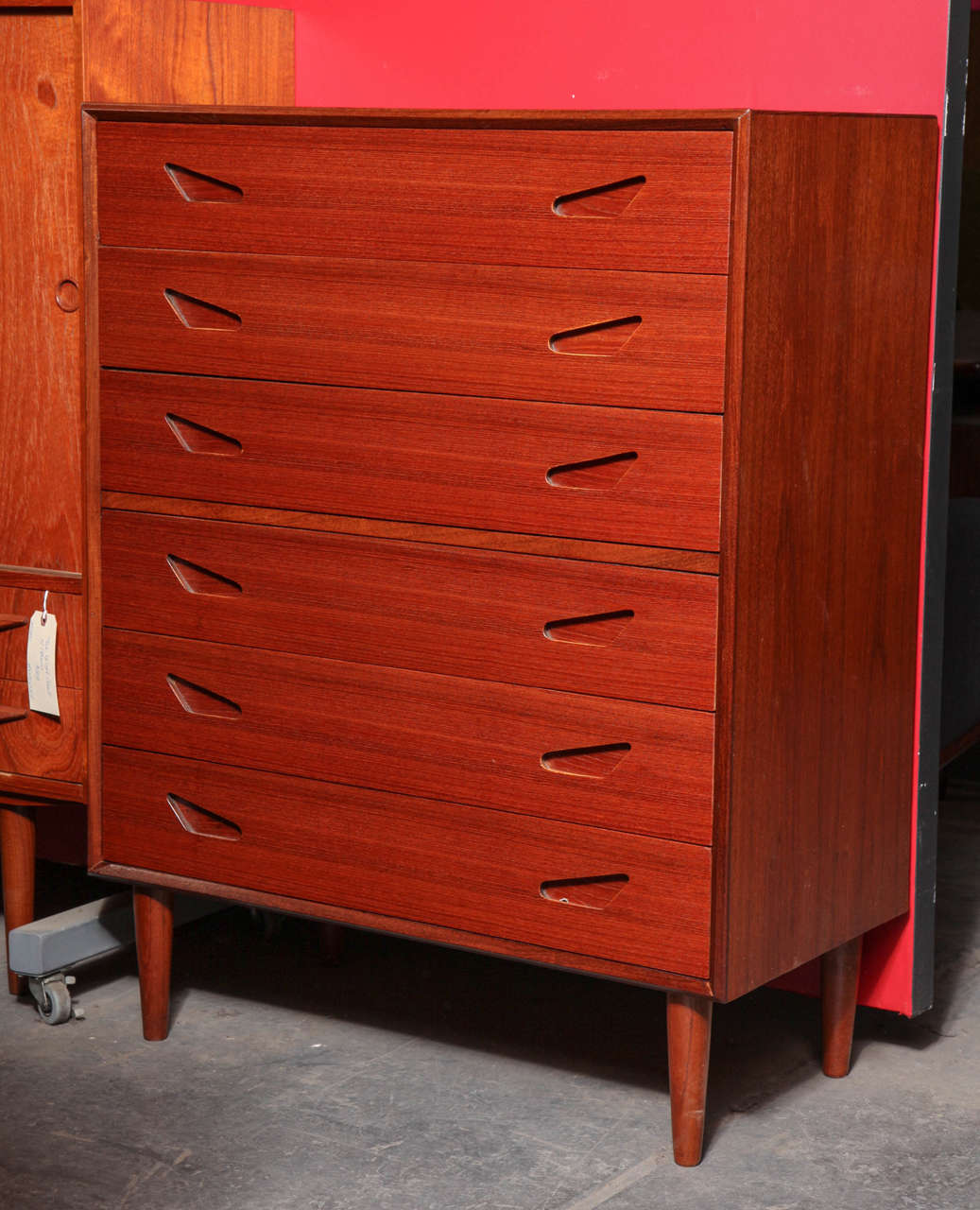 Vintage 1950s Atomic Dresser by Svend & Madsen 

This Danish Modern Chest of Drawers is in like-new condition. Beautifully built and unique; this tallboy's drawer interiors are built from mahogany wood, a natural bug repellent. Six drawers give