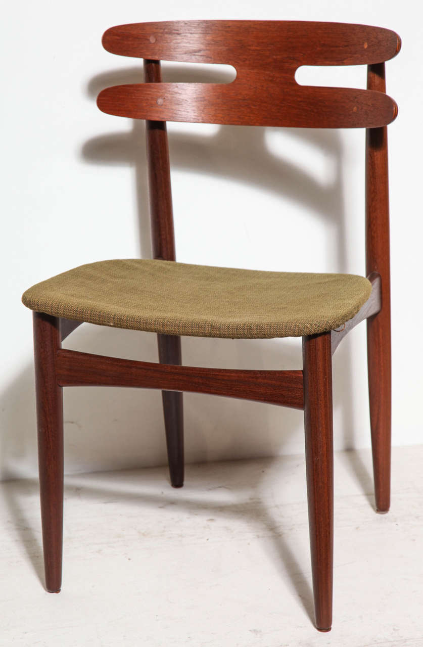 Vintage 1950s Teak Danish Dining Chairs, set of four.

This set of Vintage Teak Dining Chair cleaned up like-new. Surprisingly comfortable. Definitely one of my personal favorites that we've had. I especially like the brass accents on the back.