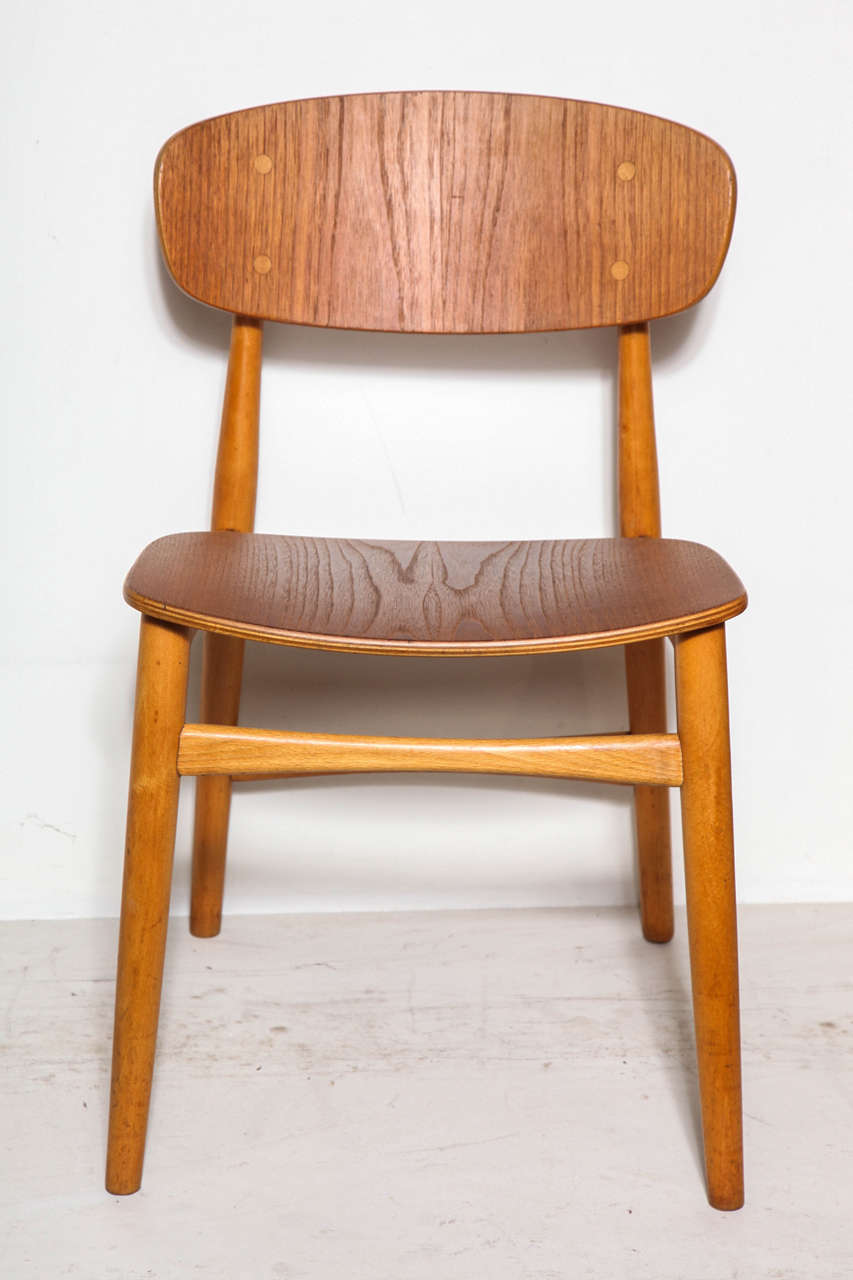 Vintage 1950s Dining Side Chairs

 Designed in the 1950s for Christiansen & Larsen of Denmark, these stunning chairs support and cradle your back. The simple and elegant design reminds us that an all wood chair does not need to look cumbersome.